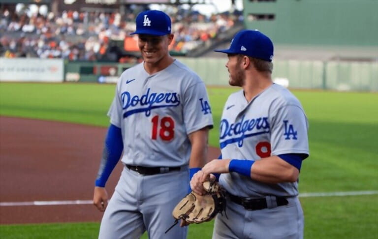 Los Angeles Dodgers infielders Jake Lamb and Gavin Lux talk on the field before a game against the San Francisco Giants at Oracle Park.