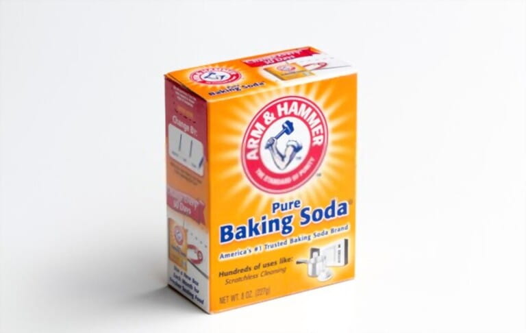 Pack of ARM and HAMMER brand pure baking soda isolated on white. The brand is marketed by Church and Dwight, a major American manufacturer of household products.