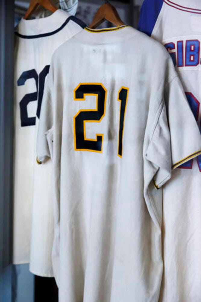 baseball shirts are hung close together