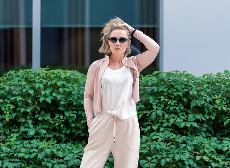 Portrait of Beautiful White Caucasian Adult Woman She is Wearing Active Lifestyle Outdoor Sportwear. Dark Sunglass. Vilnius, Lithuania. White t-shirt.