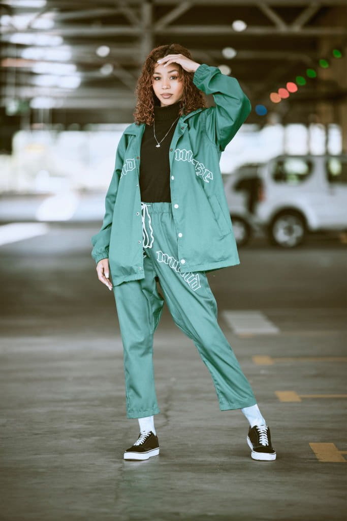 Urban, fashion and girl portrait in New York parking lot with edgy athleisure style. Gen Z, trendy outfits and statements of city young woman with assertive posture