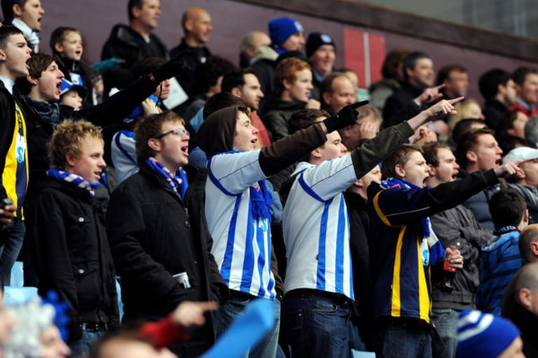 Football fans chanting at at match Football fans chanting at at match