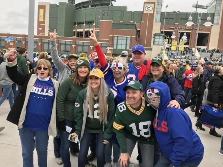 Green Bay, Wisconsin/USA. September 30, 2018. A group of football fans for the Packers and Bills gather in the parking lot of Lambeau Field before a game.